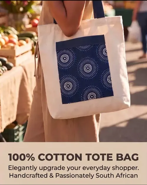 Cotton tote bag with blue shweshwe print panel at a market