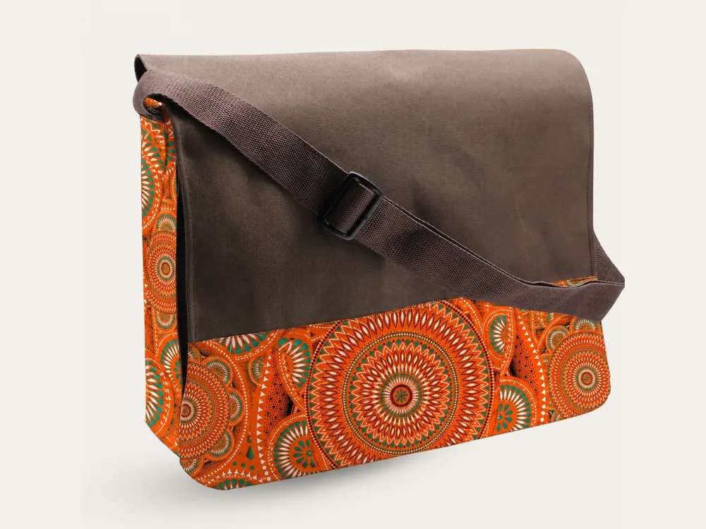 Thuli messenger bag in chocolate brown canvas with an orange ankara panel