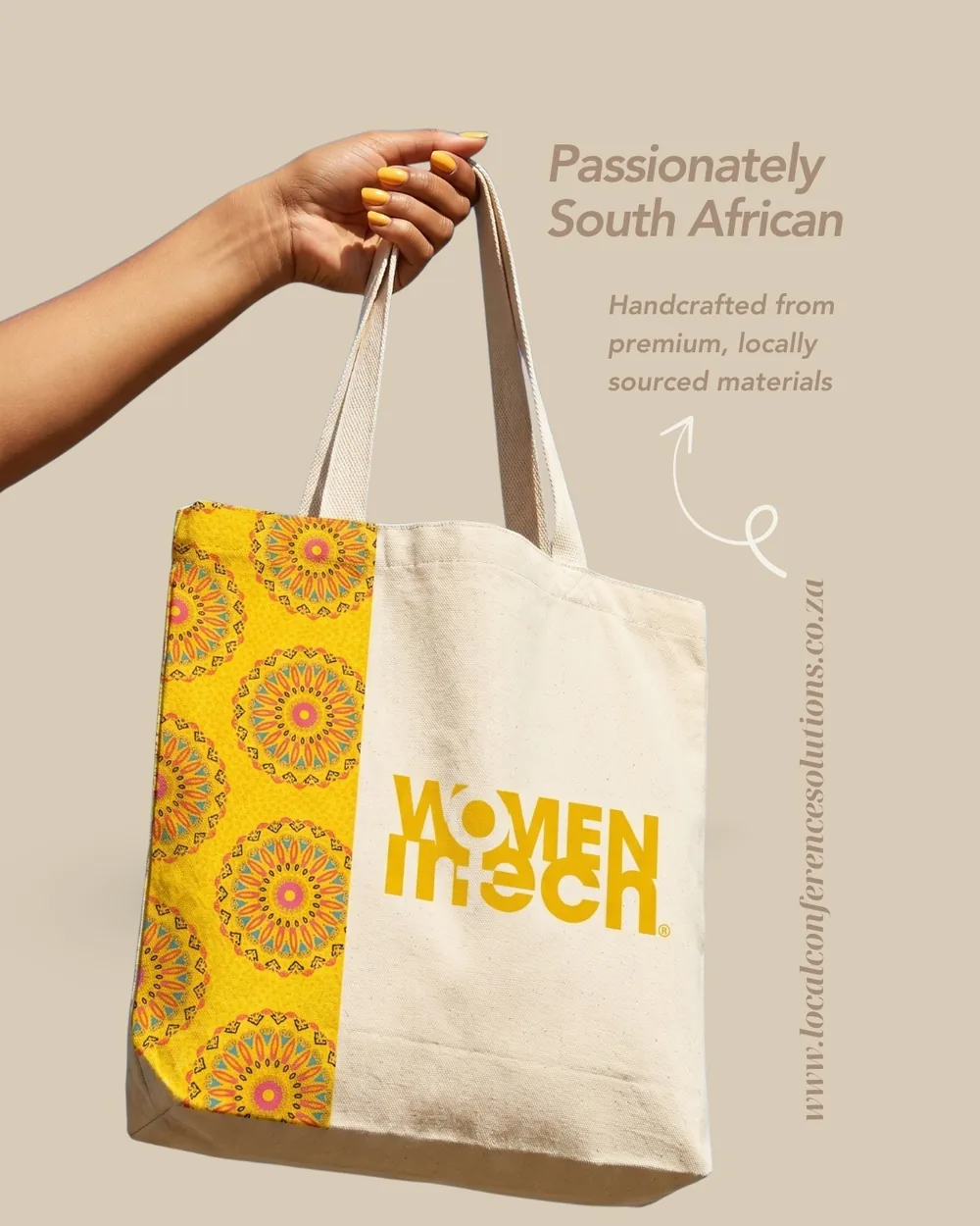 Women in Tech Global Congress branded tote bag held up against a taupe background